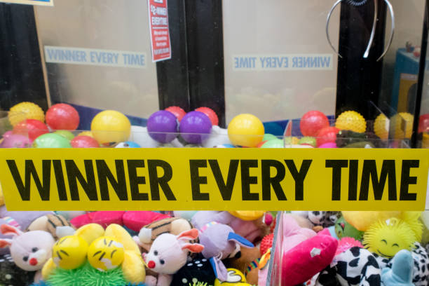 Many shots of the inside of a claw machine game amusement game