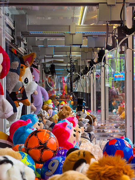 Claws with soft pluche toys in an arcade machine