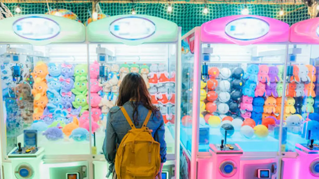 Woman playing on claw machine