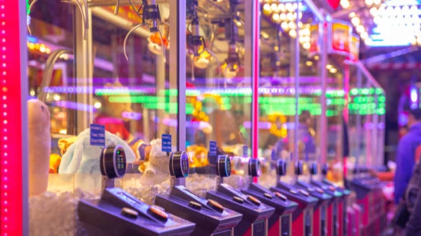 Close Up Of A Row Of Claw Machines With Digital Payment, Colorful